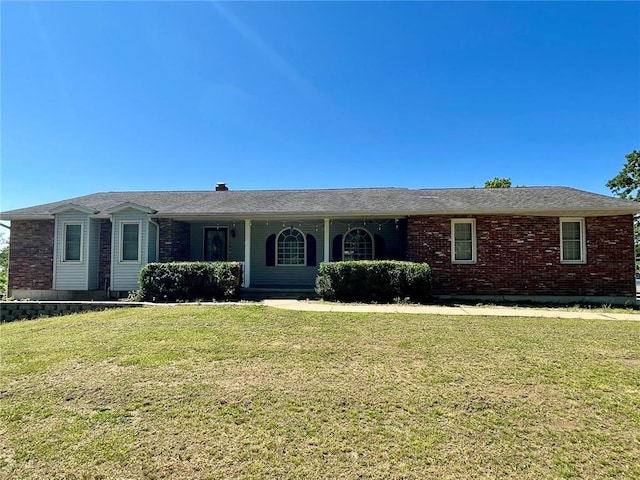 17250 Brewster Ln, Crocker, MO 65452 - ranch-style home featuring a front lawn, a porch, and brick siding