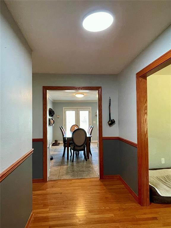 17250 Brewster Ln, Crocker, MO 65452 - corridor with light wood-type flooring, baseboards, and french doors
