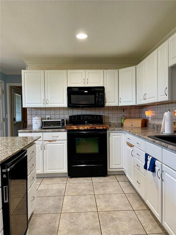 17250 Brewster Ln, Crocker, MO 65452 - kitchen featuring black appliances, wine cooler, decorative backsplash, ornamental molding, and white cabinetry