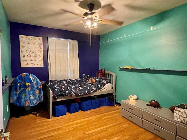17250 Brewster Ln, Crocker, MO 65452 - bedroom featuring wood finished floors and a ceiling fan