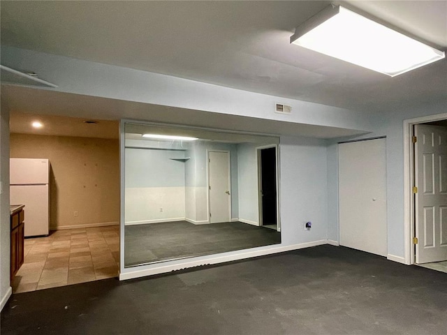 17250 Brewster Ln, Crocker, MO 65452 - finished below grade area featuring freestanding refrigerator and baseboards