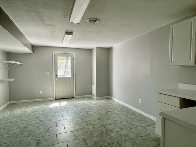 17250 Brewster Ln, Crocker, MO 65452 - unfurnished dining area featuring baseboards