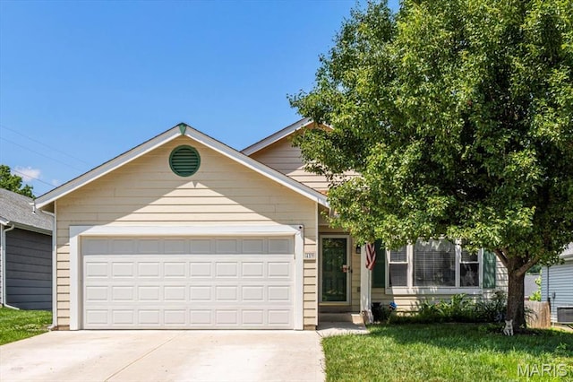 459 Xavier Ct, Valley Park, MO 63088 - view of front of house with driveway, a garage, and a front yard