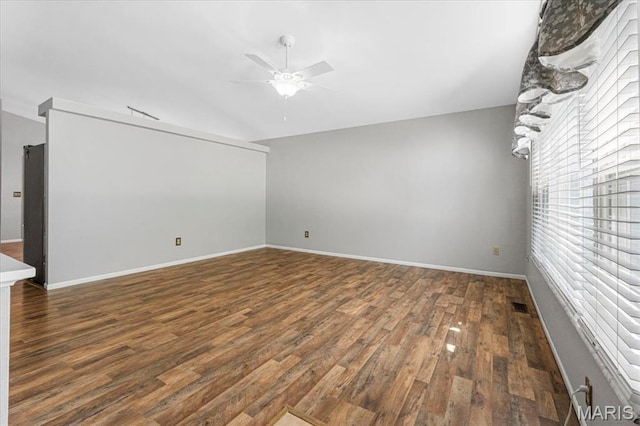 459 Xavier Ct, Valley Park, MO 63088 - spare room with a ceiling fan, healthy amount of natural light, wood finished floors, and baseboards