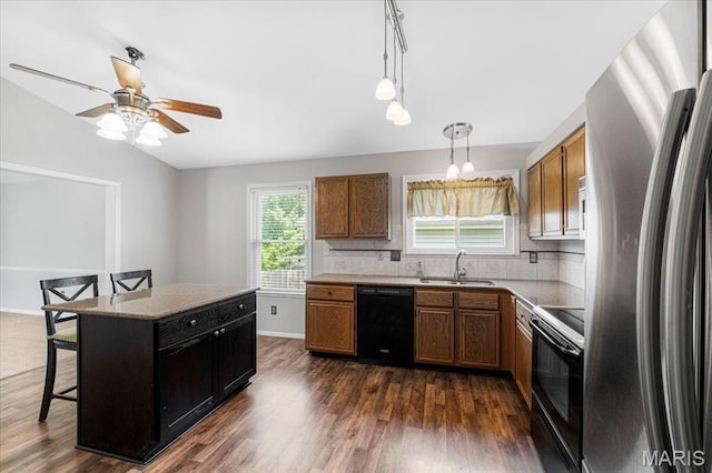 459 Xavier Ct, Valley Park, MO 63088 - kitchen featuring black appliances, a sink, dark wood finished floors, brown cabinets, and ceiling fan