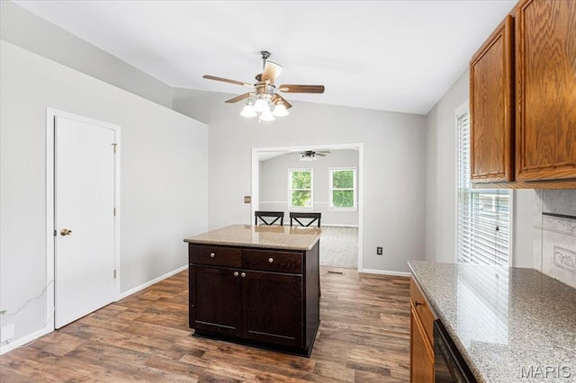459 Xavier Ct, Valley Park, MO 63088 - kitchen with lofted ceiling, ceiling fan, dark wood-style floors, light stone countertops, and baseboards