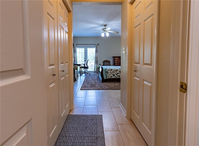 1300 N Main St Unit 213, Sikeston, MO 63801 - hall with light tile patterned flooring and a textured ceiling