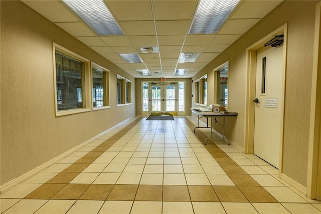 1300 N Main St Unit 213, Sikeston, MO 63801 - corridor featuring french doors, a drop ceiling, and light tile patterned flooring