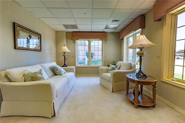 1300 N Main St Unit 213, Sikeston, MO 63801 - carpeted living area with healthy amount of natural light, a drop ceiling, and baseboards