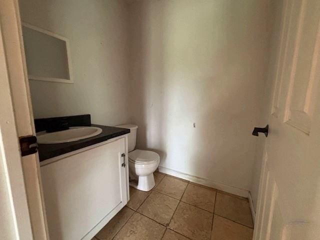 15606 County Road 624, Dexter, MO 63841 - bathroom with vanity, toilet, and tile patterned flooring