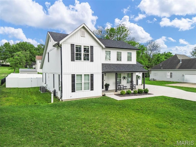 28 Millwell Dr, Maryland Heights, MO 63043 - rear view of house with covered porch, roof with shingles, and concrete driveway