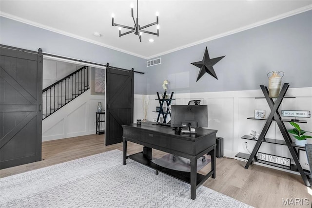 28 Millwell Dr, Maryland Heights, MO 63043 - office featuring a barn door, wood finished floors, a decorative wall, ornamental molding, and a chandelier