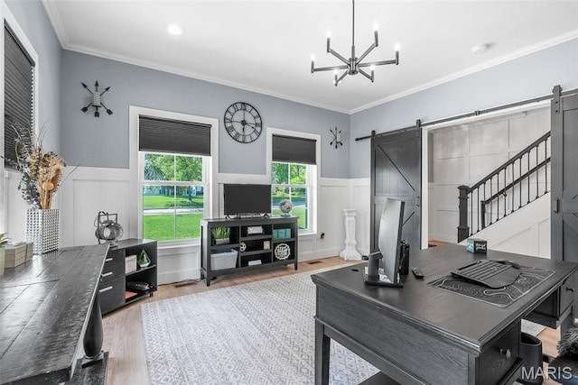 28 Millwell Dr, Maryland Heights, MO 63043 - office space with a barn door, wood finished floors, a chandelier, wainscoting, and ornamental molding