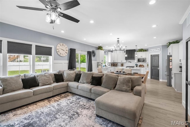 28 Millwell Dr, Maryland Heights, MO 63043 - living area featuring crown molding, a chandelier, recessed lighting, a ceiling fan, and a wainscoted wall