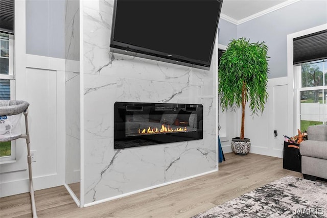 28 Millwell Dr, Maryland Heights, MO 63043 - detailed view of wood finished floors, ornamental molding, and a premium fireplace