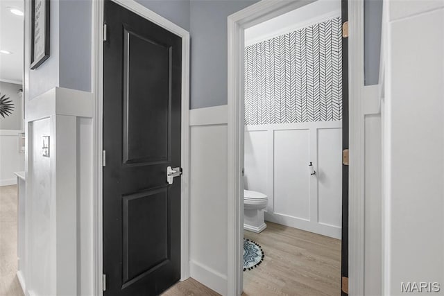 28 Millwell Dr, Maryland Heights, MO 63043 - bathroom featuring wainscoting, a decorative wall, and wood finished floors