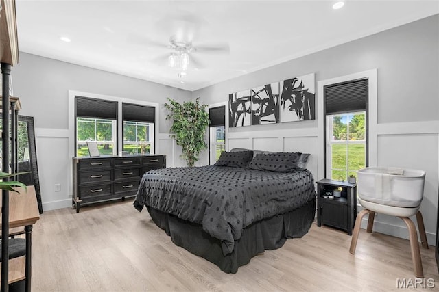28 Millwell Dr, Maryland Heights, MO 63043 - bedroom with a decorative wall, wainscoting, light wood-style floors, ceiling fan, and recessed lighting