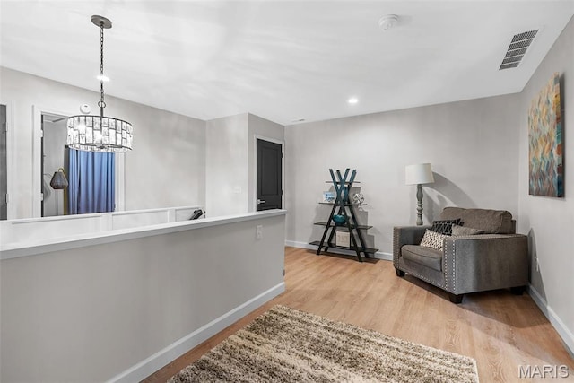 28 Millwell Dr, Maryland Heights, MO 63043 - sitting room featuring light wood-style floors, a chandelier, and recessed lighting