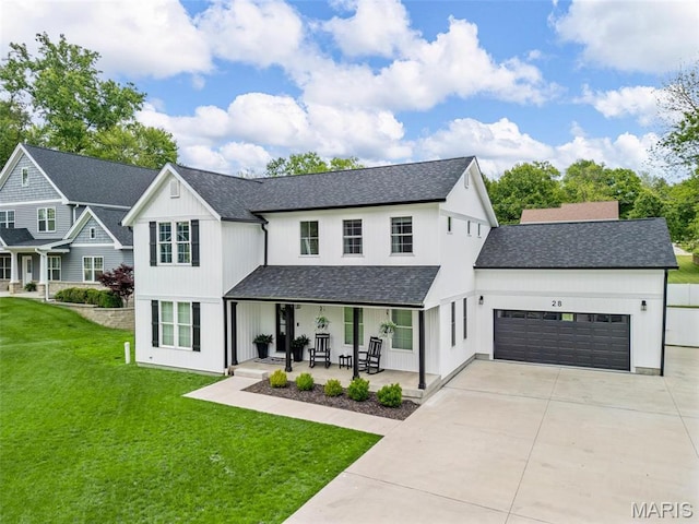 28 Millwell Dr, Maryland Heights, MO 63043 - modern farmhouse style home featuring covered porch, an attached garage, a front lawn, driveway, and roof with shingles