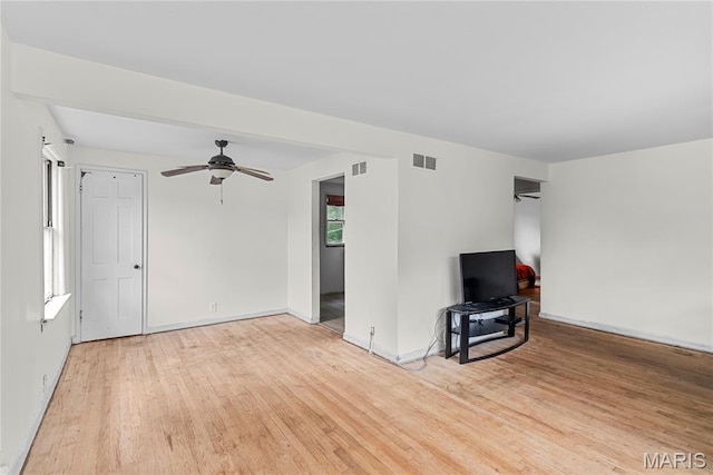 1937 N Hanley Rd, Saint Louis, MO 63114 - unfurnished living room with ceiling fan and light wood-style floors