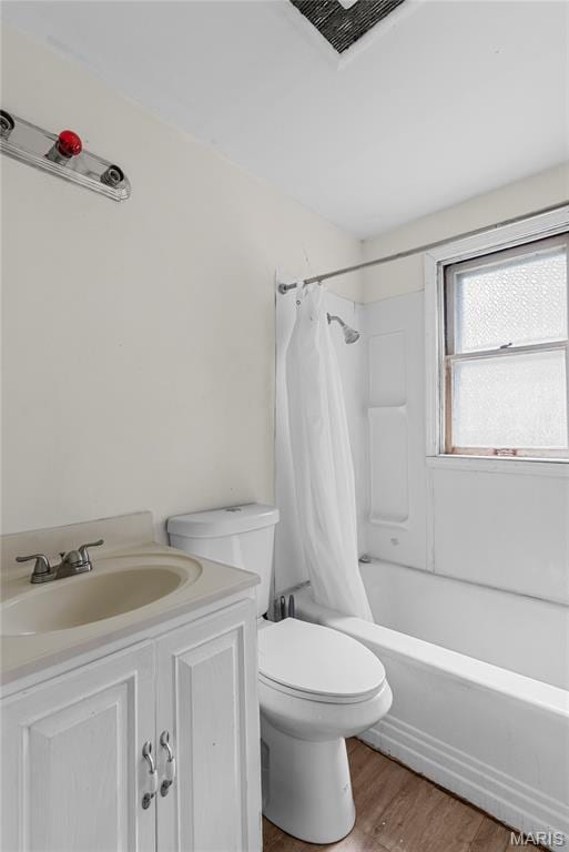 1937 N Hanley Rd, Saint Louis, MO 63114 - full bath with wood finished floors, shower / bathtub combination with curtain, and vanity
