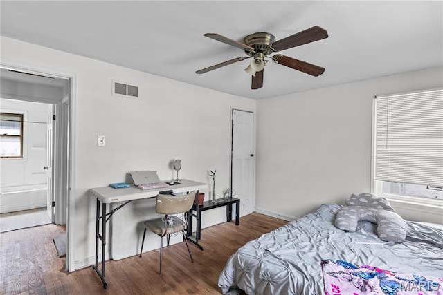 1937 N Hanley Rd, Saint Louis, MO 63114 - bedroom featuring wood finished floors, a desk, and a ceiling fan