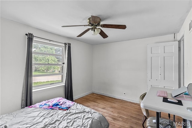 1937 N Hanley Rd, Saint Louis, MO 63114 - bedroom with wood finished floors and a ceiling fan