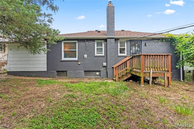 1937 N Hanley Rd, Saint Louis, MO 63114 - back of house with a chimney and a wooden deck
