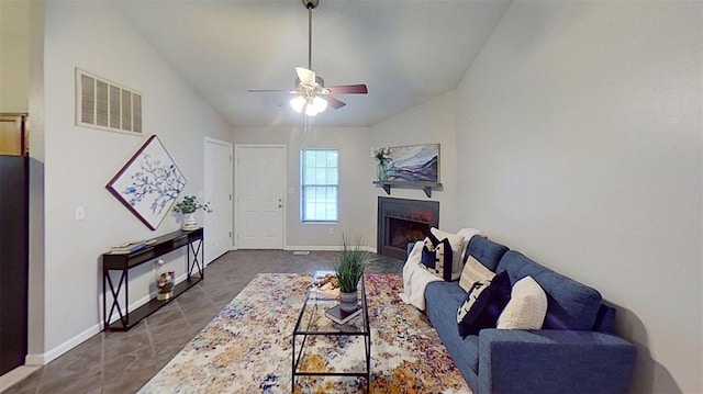 21 Fox Meadow Ln Unit A, Glen Carbon, IL 62034 - living room with lofted ceiling, ceiling fan, a fireplace, baseboards, and dark tile patterned flooring