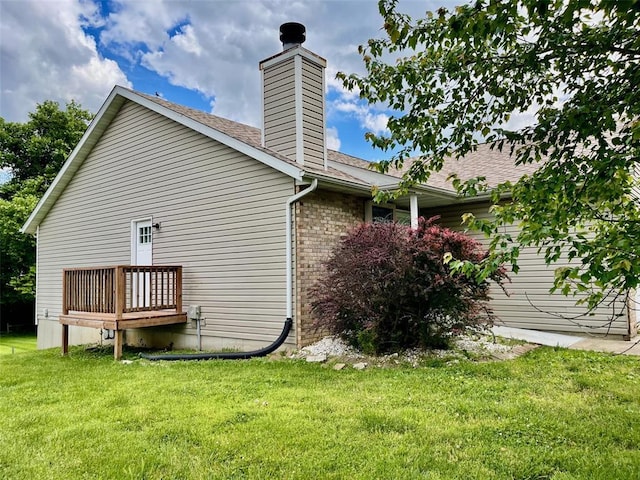 21 Fox Meadow Ln Unit A, Glen Carbon, IL 62034 - view of side of home featuring a yard, a chimney, and a shingled roof