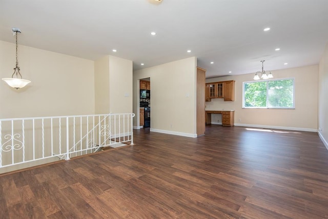 505 Stephanie Ln, Manchester, MO 63011 - unfurnished living room with dark wood-type flooring, recessed lighting, baseboards, and a chandelier