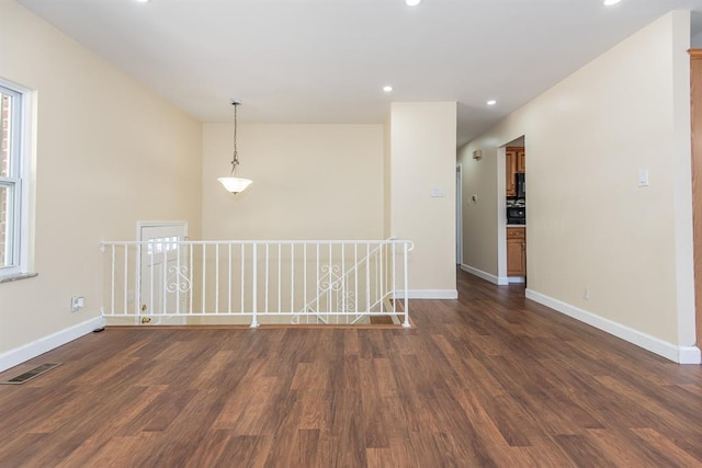505 Stephanie Ln, Manchester, MO 63011 - empty room with dark wood-type flooring, baseboards, and recessed lighting