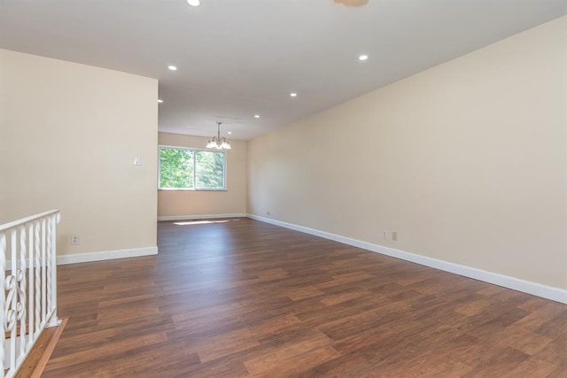505 Stephanie Ln, Manchester, MO 63011 - empty room with a chandelier, recessed lighting, dark wood-style flooring, and baseboards