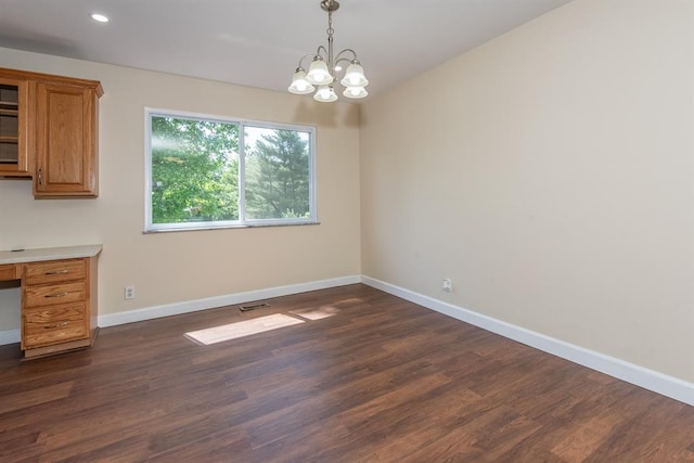 505 Stephanie Ln, Manchester, MO 63011 - unfurnished dining area with a chandelier, dark wood-style floors, baseboards, recessed lighting, and a desk