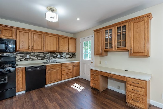 505 Stephanie Ln, Manchester, MO 63011 - kitchen with black appliances, brown cabinetry, dark wood-style floors, backsplash, and light countertops