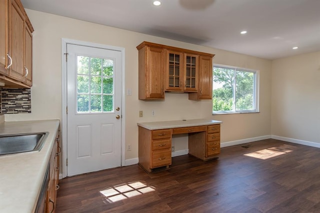 505 Stephanie Ln, Manchester, MO 63011 - kitchen featuring brown cabinets, dark wood-type flooring, light countertops, baseboards, and recessed lighting