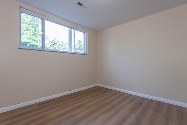 505 Stephanie Ln, Manchester, MO 63011 - empty room featuring plenty of natural light, wood finished floors, and baseboards