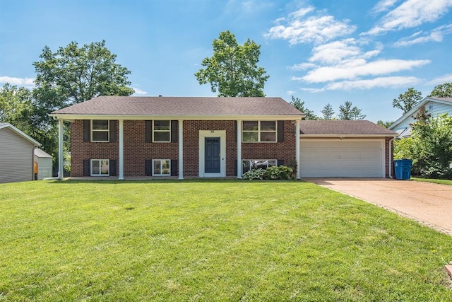 505 Stephanie Ln, Manchester, MO 63011 - raised ranch with an attached garage, driveway, a front lawn, and brick siding