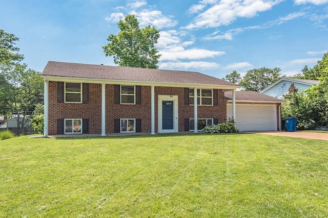 505 Stephanie Ln, Manchester, MO 63011 - bi-level home featuring an attached garage, a front lawn, and driveway