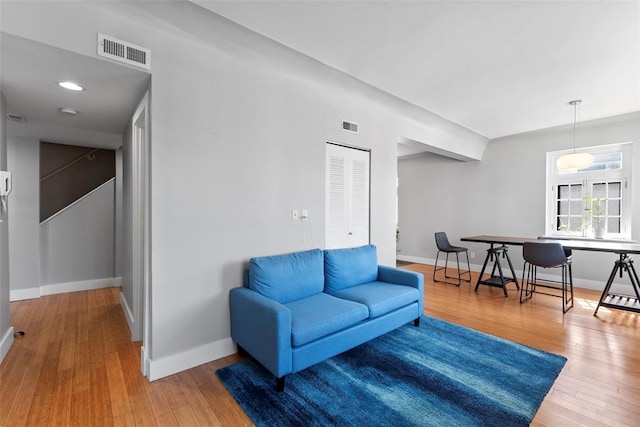 603 Westgate Ave Unit 603E, Saint Louis, MO 63130 - living area featuring baseboards and wood finished floors