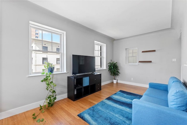 603 Westgate Ave Unit 603E, Saint Louis, MO 63130 - living area featuring plenty of natural light, baseboards, and wood finished floors