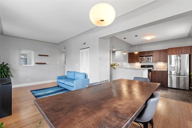 603 Westgate Ave Unit 603E, Saint Louis, MO 63130 - dining area with wood-type flooring and baseboards