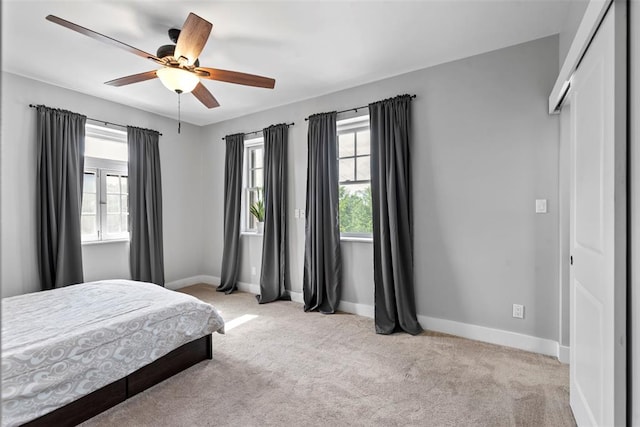 603 Westgate Ave Unit 603E, Saint Louis, MO 63130 - carpeted bedroom with baseboards and ceiling fan