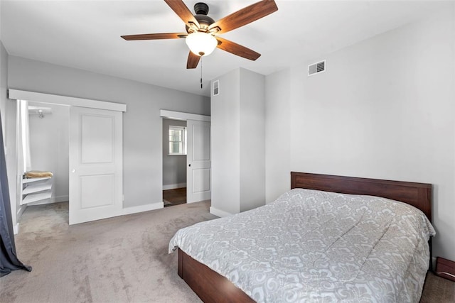 603 Westgate Ave Unit 603E, Saint Louis, MO 63130 - bedroom with carpet floors, baseboards, and a ceiling fan