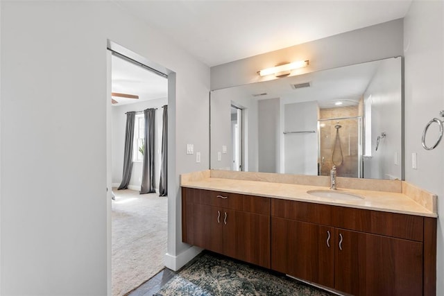 603 Westgate Ave Unit 603E, Saint Louis, MO 63130 - full bath with vanity, a shower stall, baseboards, and a ceiling fan