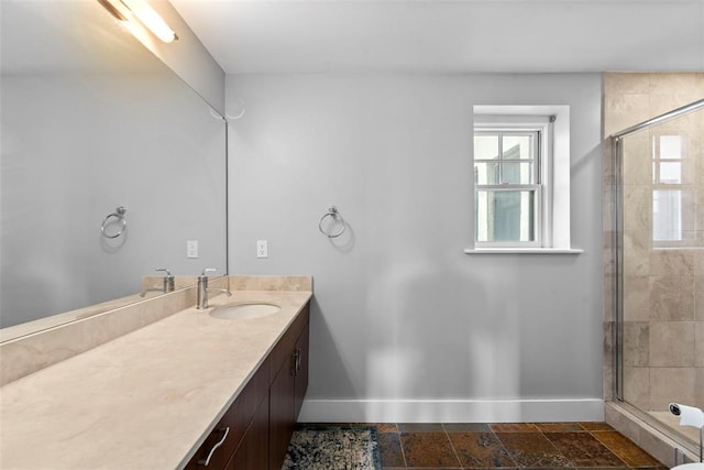 603 Westgate Ave Unit 603E, Saint Louis, MO 63130 - full bath featuring baseboards, vanity, and a tile shower
