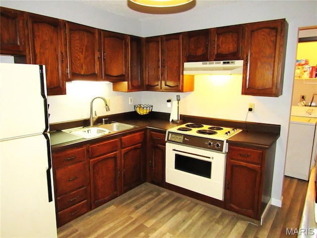 1826 Muny Vista Ct Unit B, Alton, IL 62002 - kitchen featuring white appliances, under cabinet range hood, reddish brown cabinets, a sink, and dark countertops