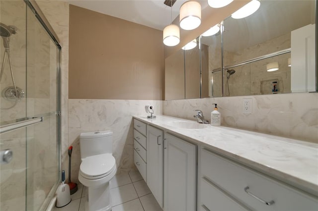 204 Chestnut Dr, Saint Charles, MO 63301 - full bathroom with toilet, vanity, a shower stall, tile walls, and wainscoting