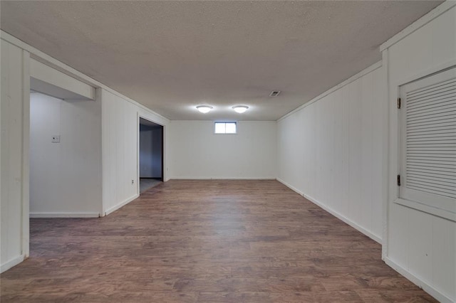 204 Chestnut Dr, Saint Charles, MO 63301 - spare room featuring wood finished floors, a textured ceiling, and baseboards