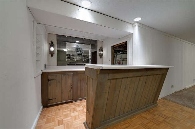 204 Chestnut Dr, Saint Charles, MO 63301 - indoor bar featuring wood walls, baseboards, and a textured ceiling